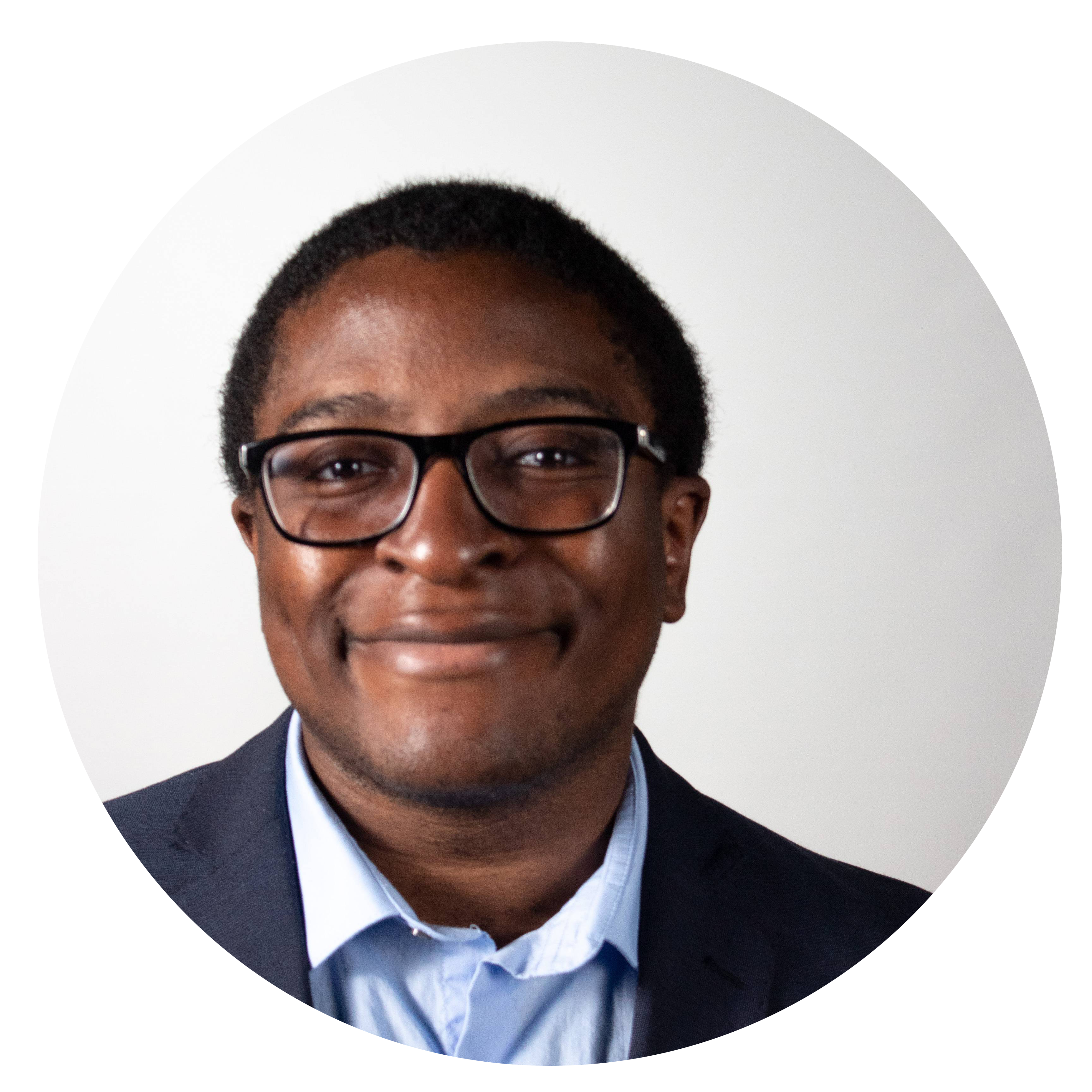 Black man in a suit and glasses.